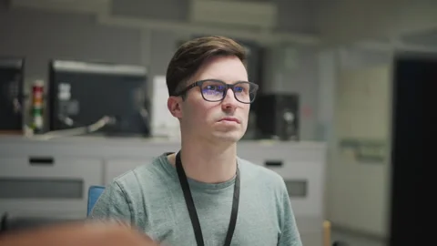 Person working at computer in modern office with multiple monitors Stock Footage 317539951