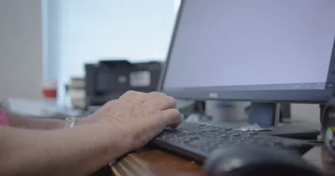 Person Working on a Computer in an Office Stock Footage 200790075
