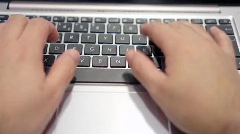Person working on computer, typing on keyboard Foto stock