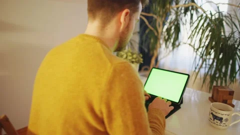 Person Working Desk Remotely Freelancer Greenscreen Laptop Tablet Video stock 195289718