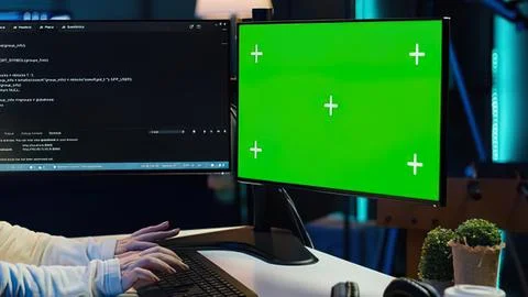 Person working on green screen computer setup Stock Photos