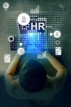 Person working on human resources tasks with digital icons representing Stock Photos