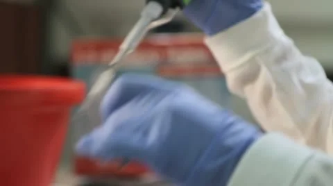 A person working in a laboratory using a syringe Stock Footage 10679740