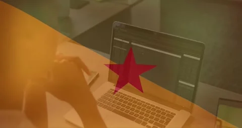 Person working on laptop with coding animation over red star and yellow Stockbeeldmateriaal 329565576