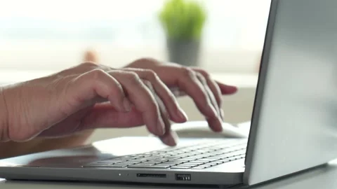 Person working on laptop fast typing on keyboard in home office Stock Footage 315688399