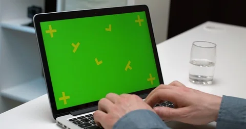 A Person Working On The Laptop Notebook With Green Screen For Chroma Key Stock Footage 105466193