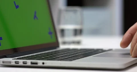 A Person Working On Notebook Laptop With Green Screen For Chroma Key Stock Footage 106170248