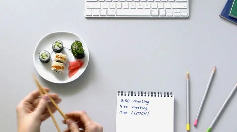Person working in the office decided to have lunch Sushi Stock Footage 61931855