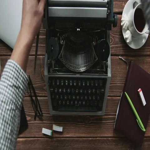 Person working on old typewriter Stock Footage 69544398