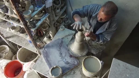 A person working on a pottery machine Stock Footage 236587002