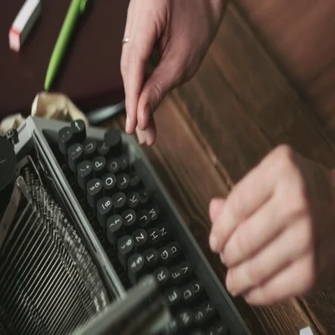 Person working on typewriter Stock Footage 69544578
