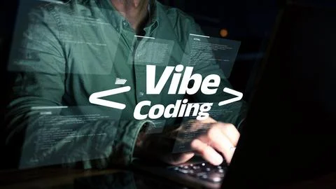 Person working on vibe coding at night with glowing computer screen Stock-Fotos