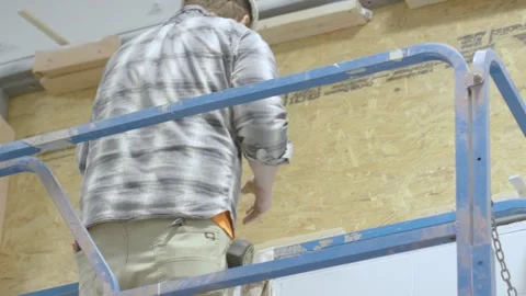 Person Working on Window install Stock Footage 238859242