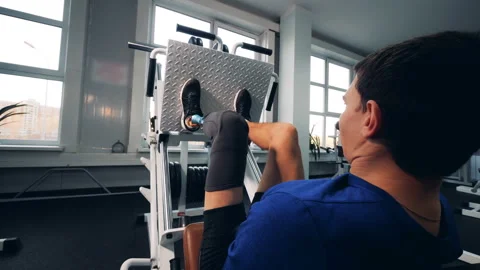 Person workouts at a gym, wearing bionic leg prosthesis. Stock Footage 105003860