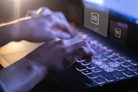 Person works with documents, data files on a laptop. Stock Photos