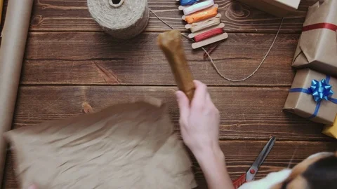 Person wrapping bone for dog Stock Footage 69930144