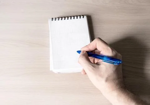 Person write in Notepad Stock Photos