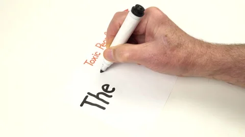 Person writes by hand the name of one of the types of Toxic People  Stock Footage 314616418