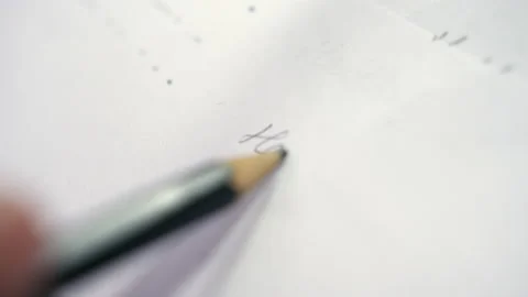 Person writes hello on blank sheet of paper with pencil Stock Footage 228780137