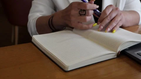 The person is writing in a notebook Stock Footage 319826329