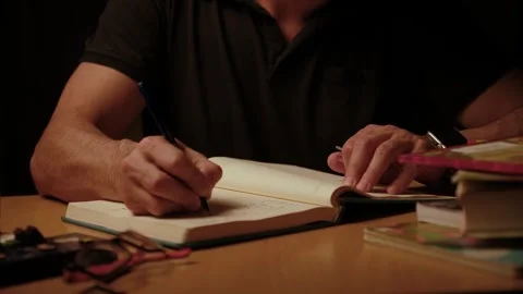 Person writing notes in notebook Stock Footage 332207541