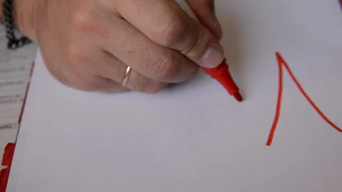 Person writing on a paper Видео 139980892
