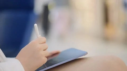 Person is writing on a tablet with a pen Stock Footage 316975811