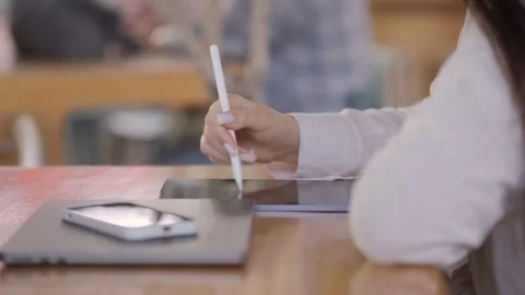 Person is writing on a tablet with a pen Stock-Footage 316975907
