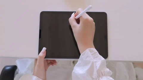 Person is writing on a tablet with a pen Stock Footage 327216804