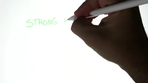 Person writing in a tablet strong hands never sell and a bitcoin symbol Stock Footage