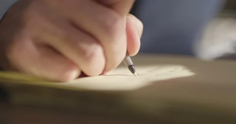 Person Writing On Yellow Notepad, Close Up, Pen to Paper, Office Work, Taking Stock Footage 273172798