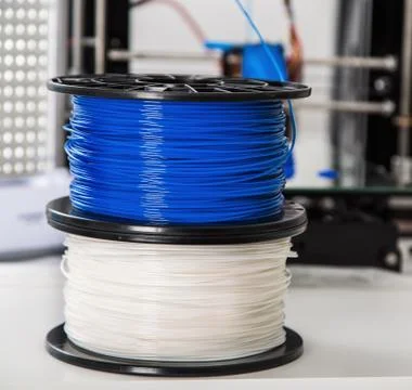 Personal 3d printer and abs or pla filament coils next to him Stock Photos