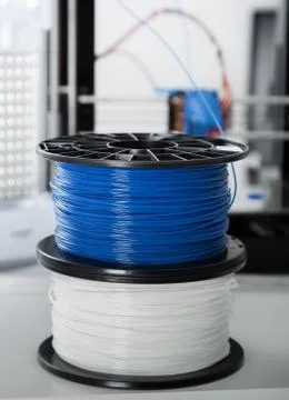 Personal 3d printer and abs or pla filament coils next to him Stock Photos