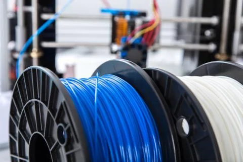 Personal 3d printer and abs or pla filament coils next to him Stock Photos