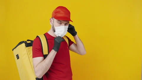 Personal and client protection. Studio shot of delivery man with thermo backpack Stock Footage 149624809