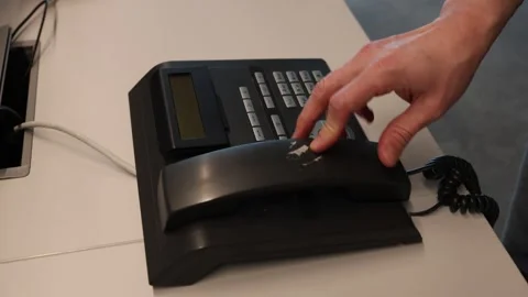 Personal business use desk using the system phone Video stock 345720303