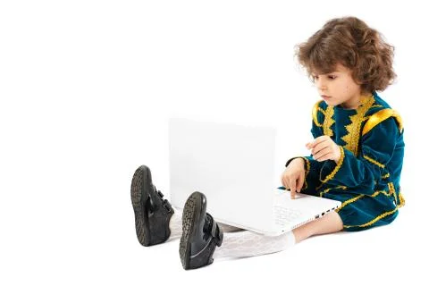 Personal computer and a boy dressed as a king Stock Photos