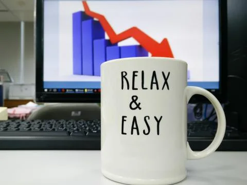 Personal computer and a cup Stock Photos
