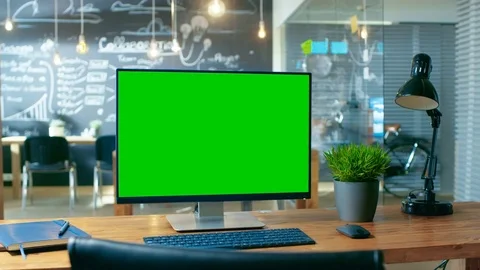 Personal Computer with Mock-up Green Screen Monitor Stands on the Office Desk. Stock Footage 83159177