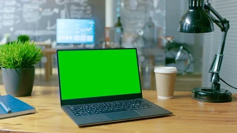 Personal Computer with Mock-up Green Screen Monitor Stands on the Office Desk.  Stock Footage 83160723