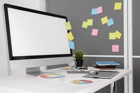 Personal computer office workspace with sticky notes Stock Photos