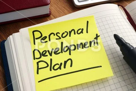 Personal development plan. Memo stick in the notepad. Stock Photos