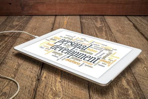 Personal development word cloud on tablet Stock Photos