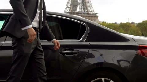 Personal driver is opening the car door for his client Stock-Footage 106987115