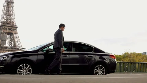 Personal driver is opening car door for women Stock Footage 117163370