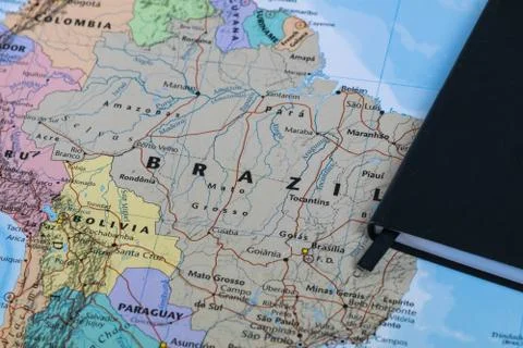 Personal lanning notes of a traveller planning a trip to Brazil over a closeup Stock Photos