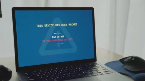 Personal or work computer in office displays hacker message for ransom Video stock 342512250