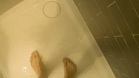 Personal perspective of a Caucasian man having a shower in a hotel bathroom Video stock 79174467