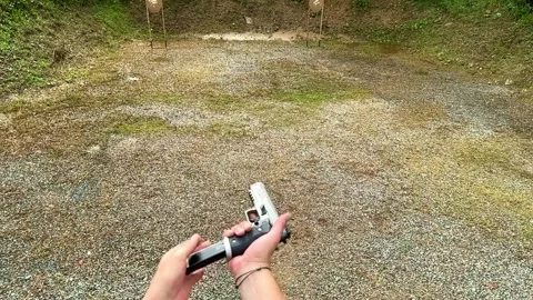 Personal Perspective on a Man Loading and Shooting His Handgun 库存影片 264756186