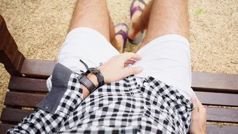 Personal Perspective of a Man Sitting in a Bench Stock Footage 83133166